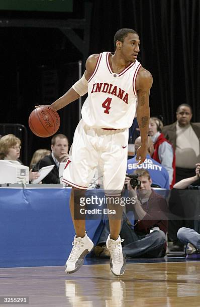 Bracey Wright of the Indiana University Hoosiers moves the ball against the Ohio State University Buckeyes during the Big Ten Tournament at the...