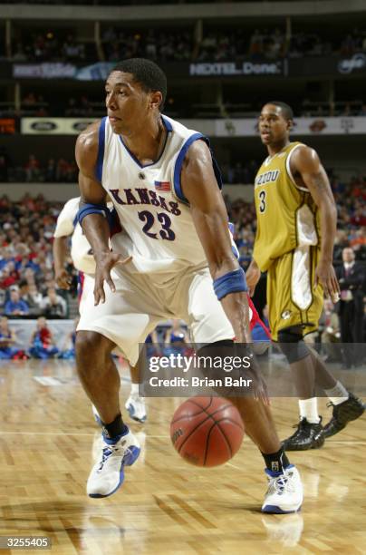 Wayne Simien of the University of Kansas Jayhawks moves the ball against the University of Missouri Tigers during the quarterfinals of the Phillips...