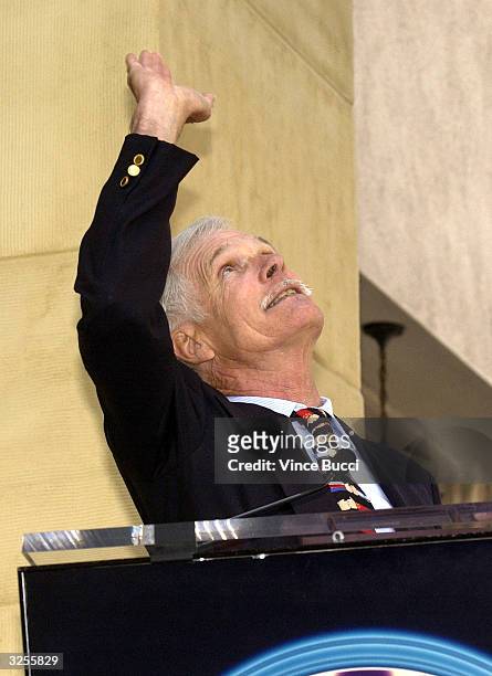 Media magnate Ted Turner gestures as he attends a ceremony honoring him with a star on the Hollywood Walk of Fame April 7, 2004 in Hollywood,...