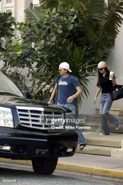 Actor Ashton Kutcher and actress Demi Moore leave the Raleigh Hotel on April 5, 2004 in Miami Beach, Florida.