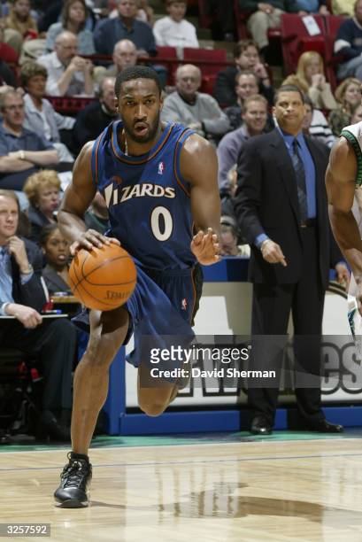 Gilbert Arenas of the Washington Wizards drives against the Minnesota Timberwolves during the game at Target Center on April 2, 2004 in Minneapolis,...