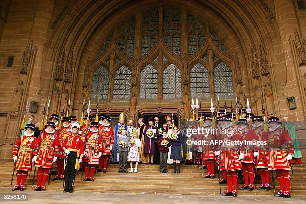 Britain's Queen Elizabeth II poses with the Yeoman of the Guard after the Royal Maundy Service held at Liverpool's Anglican Cathedral, 08 April,...