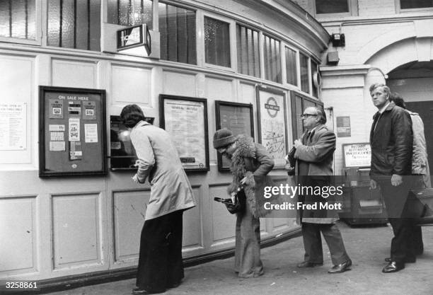 Queue at the ticket office at Gloucester Road underground station, London.