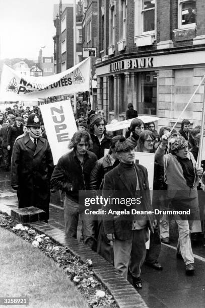 Kingston upon Thames dustmen take to the streets in a demonstration march about expenses.