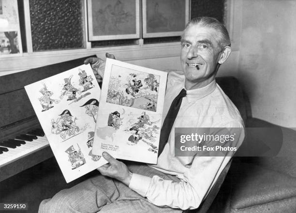 British cartoonist Anson Dyer, proudly displays drawings from his animated film Sam.