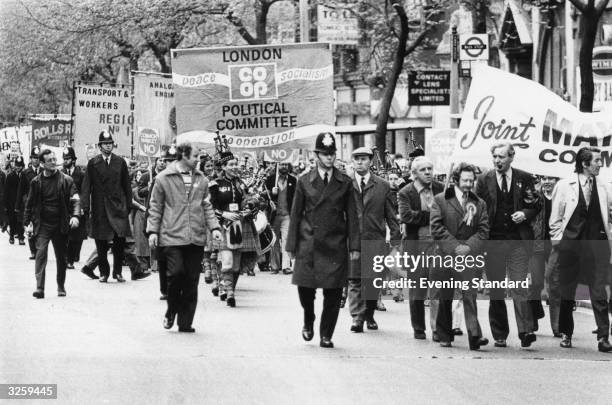 Tony Benn , the Labour politician, leads a march on May Day 1975, through London.