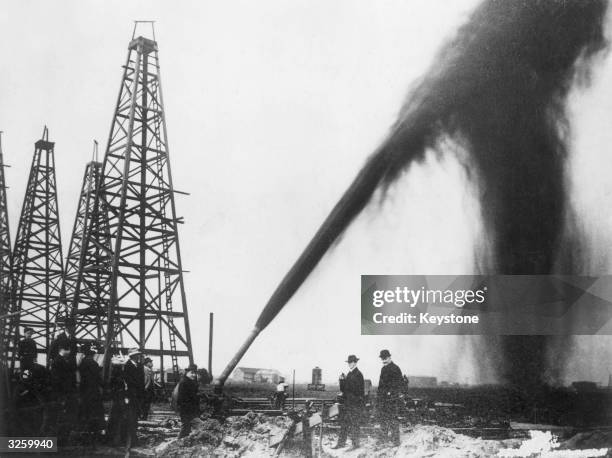Oil gushing out of a pipe on an oilfield in the U.S.A.