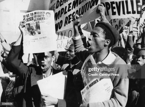 South African demonstrators holding up placards outside the hotel where the UN Secretary General was staying in Pretoria, South Africa. Some 250...