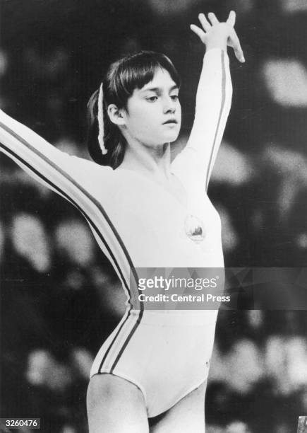Nadia Comaneci, 14 year old Romanian gymnast, scored three maximum 10 out of 10 scores at the Montreal Olympics, the first perfect scores ever...