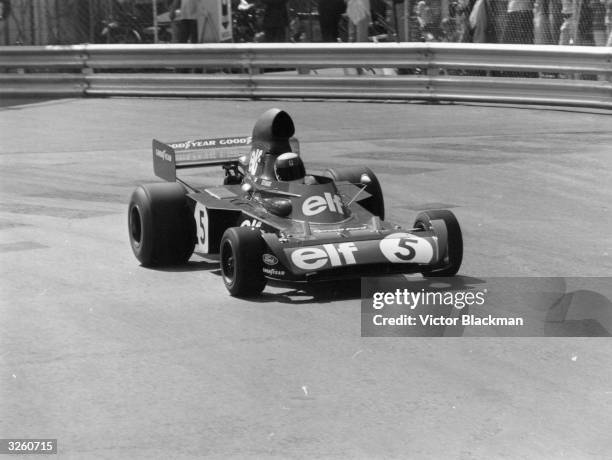 Jackie Stewart the Scottish racing driver and world champion in 1969, 1971 and 1973, driving in his racing car at the Monaco Grand Prix.