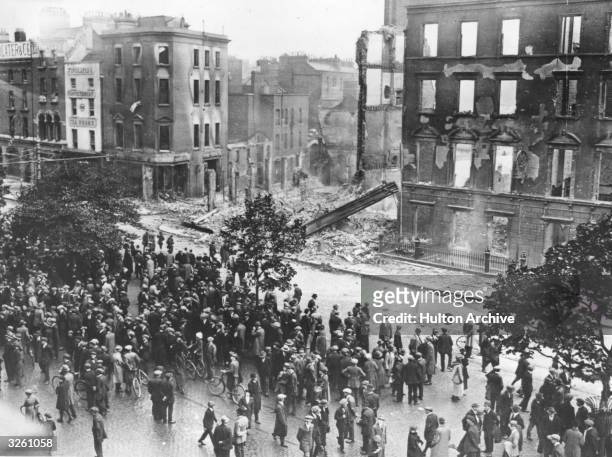 Crowds gather to view the ruins around O'Connell Street, Dublin, after fighting between Free State and Republican Forces during the Irish Civil War.