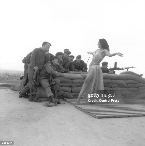 Belly dancer from Middlesex entertains British troops in Cyprus.