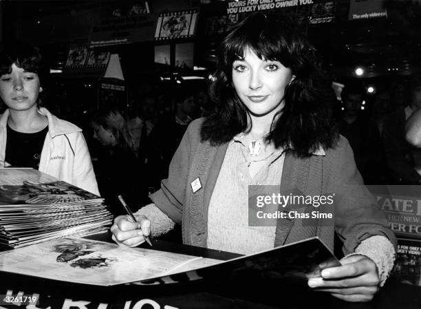 British pop singer Kate Bush signing her latest album 'Never Forever' at London's Virgin Megastore.