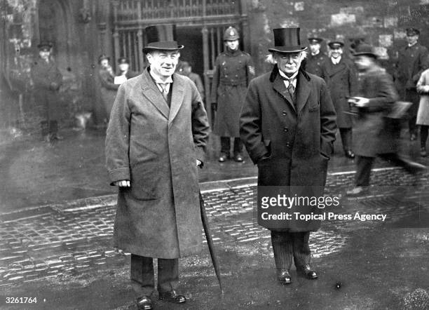 English Conservative statesman and prime minister Stanley Baldwin, , and Welsh Liberal statesman David Lloyd George at Westminster Abbey, London, to...