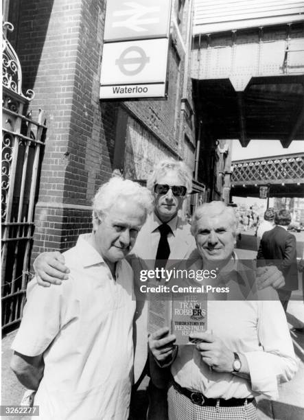 The Great Train Robbers, Roger Cordrey, Bruce Reynolds and Buster Edwards, at Waterloo Station, London, ready to go on a book promotion tour.