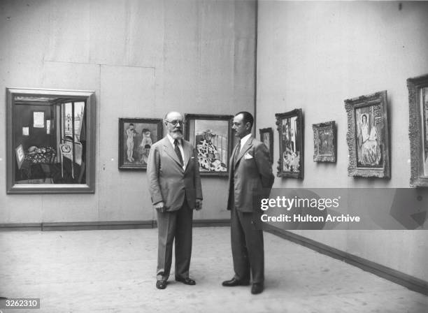 The French painter Henri Matisse at an exhibition of his work at the Galerie Georges Petit, Paris. The exhibition was organised by the collector...