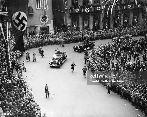 General Goering parades through the streets as the German Army reoccupy the Rhineland.