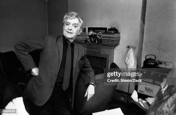 British writer Quentin Crisp relaxes in his Chelsea home.