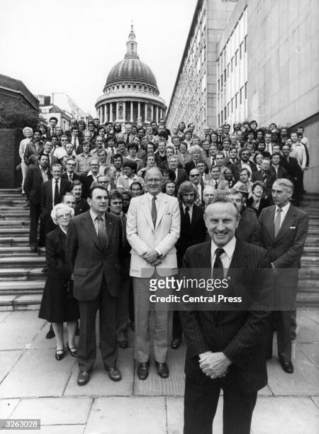 The Chairman of British Telecom, Sir George Jefferson, , with Andrew Gardner, the ITV anchorman and the British Telecomm crew. In the background is...