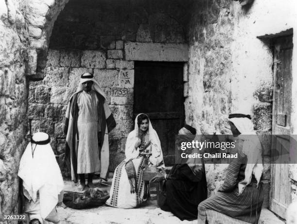 Group of Palestinians talking outside their houses in Bethlehem.