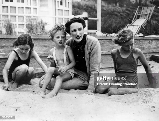 Crown Princess Martha of Norway with her three children, Astrid, aged 7, Harald, aged 3, and Ragnhild, aged 9, on the beach at their new home in...