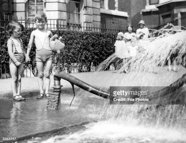 Heat wave incident outside the Tate Gallery, children who found the water cart being filled a great attraction.