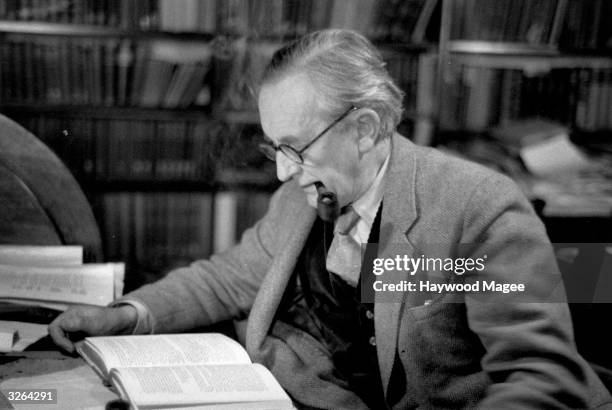 John Ronald Reuel Tolkien , British writer and professor at Merton College Oxford, reading in his study. Original Publication: Picture Post - 8464 -...