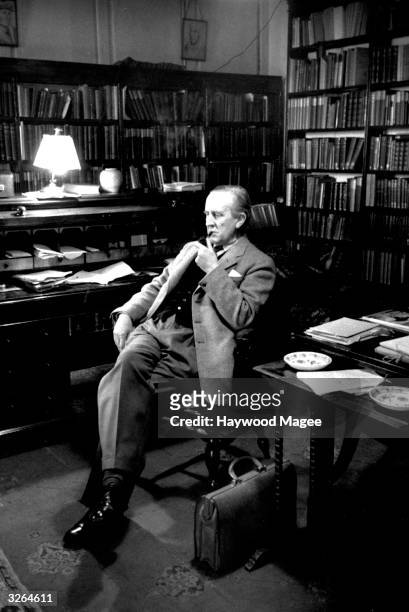 British writer John Ronald Reul Tolkien , sitting in his study at Merton College, Oxford, where he is a Fellow. Original Publication: Picture Post -...