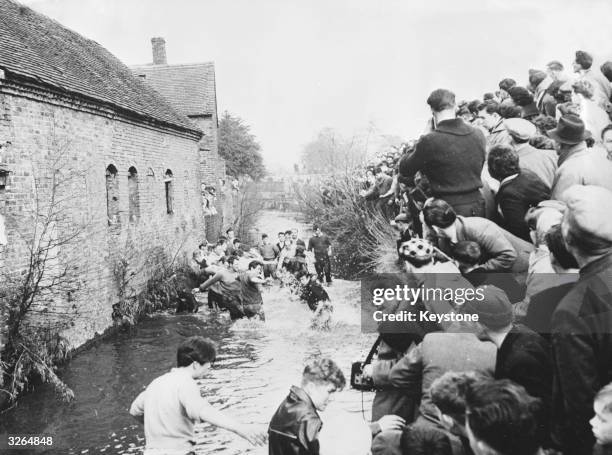 The annual Shrove Tuesday football match at Ashbourne in Derbyshire. Two teams from either side of the Henmore Brook battle it out between two goals...