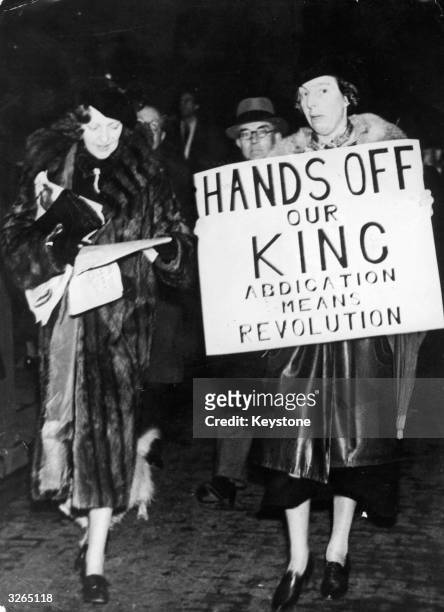 Demonstrators protest against the abdication of King Edward VIII, threatened on account of hostility towards his proposed marriage to US socialite...