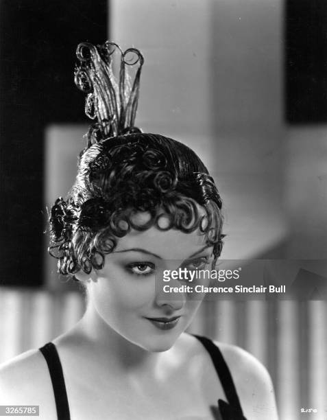 Myrna Loy , the American leading lady who was awarded an Oscar in 1991 for her lifetime achievements. She is wearing a lacquered wig created by...
