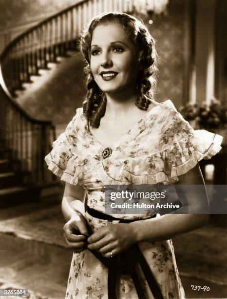 Jean Arthur plays Emma in a scene from 'Diamond Jim', a film about the life of a millionaire playboy, directed by A Edward Sutherland for Universal.