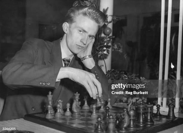 Icelandic chess champion Fridrik Olafsson makes a move at the Hastings International Chess Congress.
