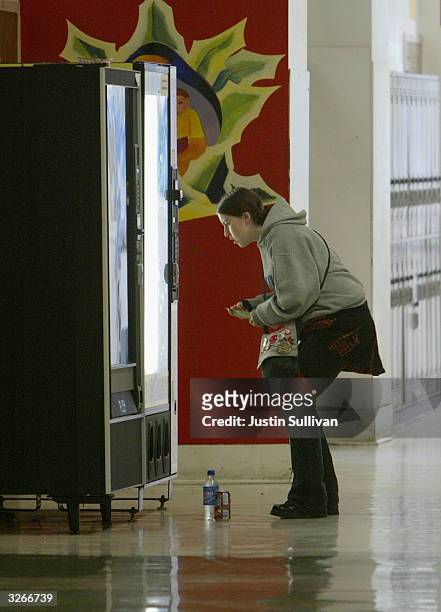 Student buys snacks from a vending machine at Mission High School April 8, 2004 in San Francisco, California. In an effort to battle obesity in...