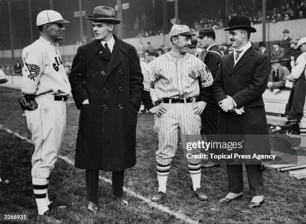 Players take a break and chat during a New York Giants v Chicago White Sox baseball game.