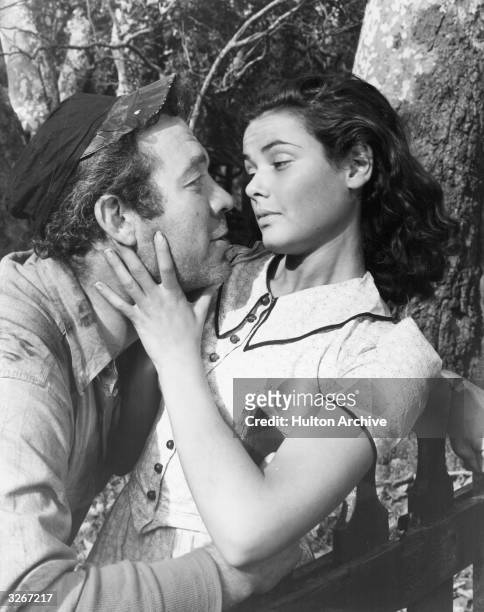 Ward Bond the American actor and his sweetheart Gene Tierney the American leading lady. They are in a scene from 'Tobacco Road' about the poor whites...
