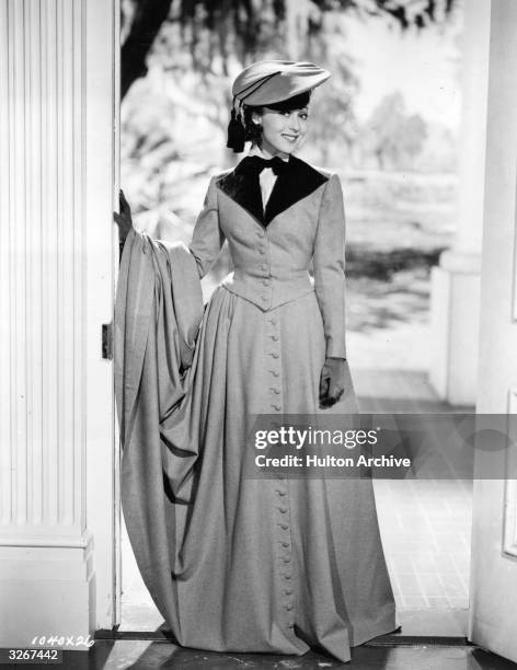 Austrian film actress Luise Rainer dressed in a riding habit, designed by Adrian in a scene from 'The Toy Wife'.