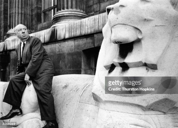 British director Alfred Hitchcock outside the British Museum in London. Original Publication: Picture Post - 7499 - A Sinister Time Was Had By All -...