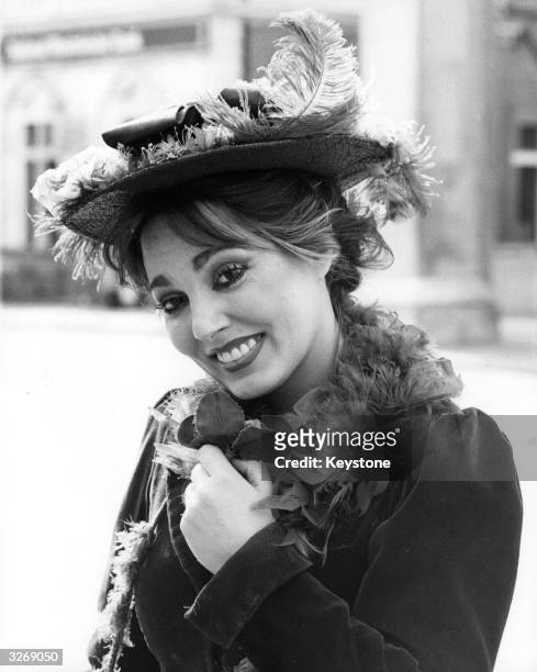 British actress Caroline Villiers dressed for her part as Eliza Doolittle in the play 'My Fair Lady'.