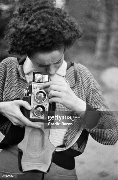 The photographer photographed with a Contax twin-lens reflex camera.
