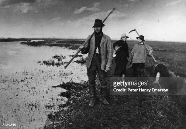 Group of reed-cutters coming home from the marshes. Platinotype by Peter Henry Emerson from 'Life And Landscapes On The Norfolk Broads'.