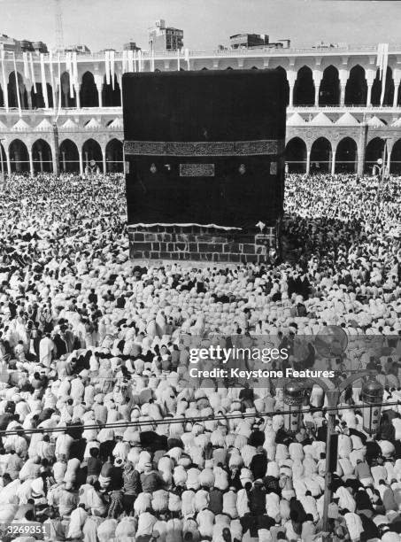 Over 500, 000 Muslims before the Kaba the most sacred site in Islam, within the precincts of the Great Mosque at Mecca. The Kaba or Ka'bah or Kaaba,...