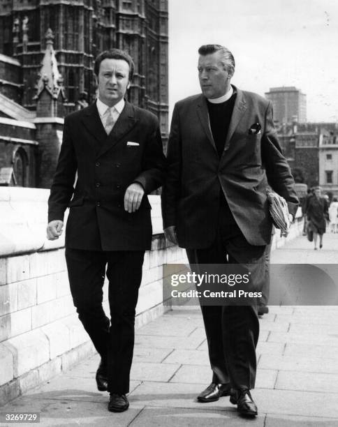 The Reverend Ian Paisley, arriving at Westminster to take his seat in the British Parliament as MP for Antrim with his deputy Peter Robinson, who...