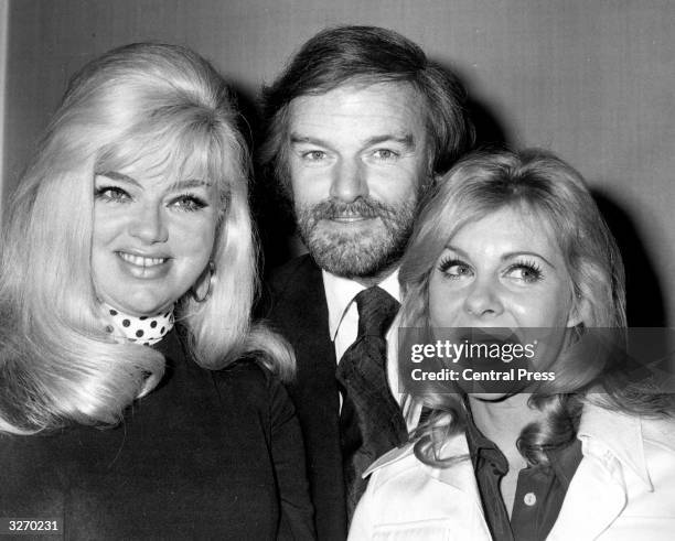 Keith Michell, the Director of the Chichester Theatre, flanked by actress Diana Dors and June Ritchie, one of the leading stars from the 1974 company...