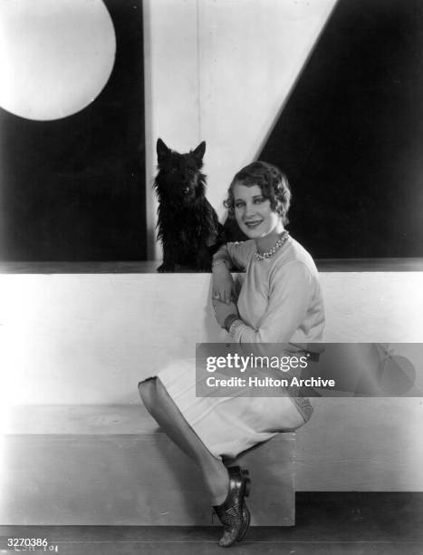 Helene Costello the American silent screen leading lady and a Warner Brothers player sitting with her favourite Scottish terrier dog. She was married...