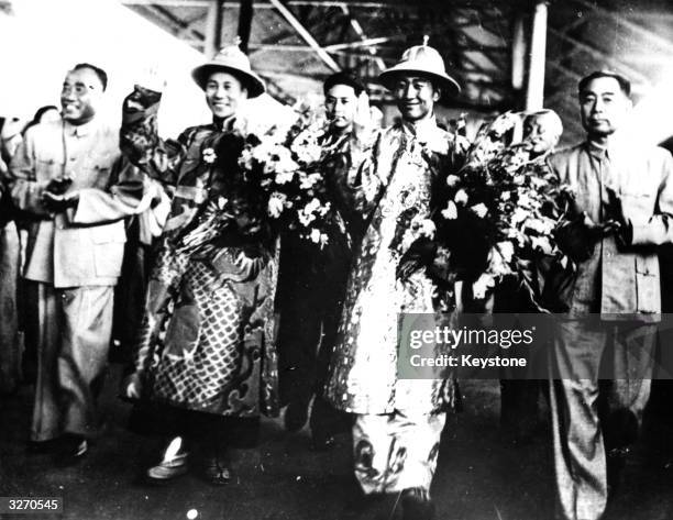 Tibetan spiritual leader the Dalai Lama on a visit to Peking with fellow spiritual leader Panchen Lama and Chinese Communist leader Chou Enlai and...