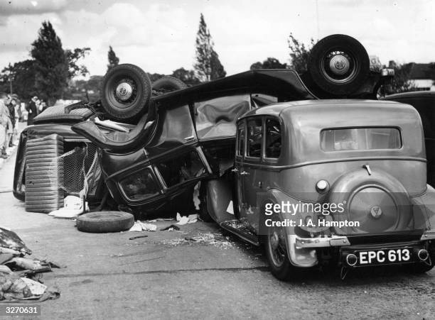 Crashed cars on the Kingston bypass near Hinchley Wood, Surrey.