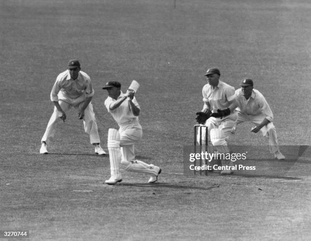 Australian cricketer Don Bradman batting during a test match against England at Trent Bridge, Nottingham. Sir Donald Bradman was the first cricketer...