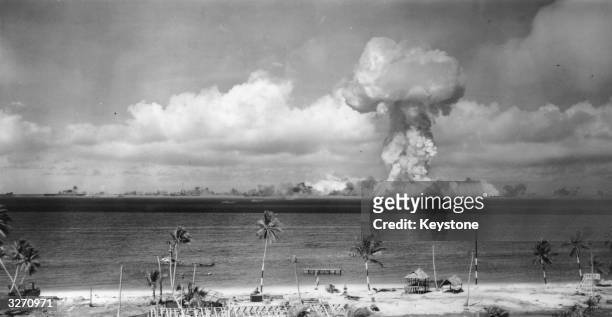 Mushroom cloud forms after the initial Atomic Bomb test explosion off the coast of Bikini Atoll, Marshall Islands.