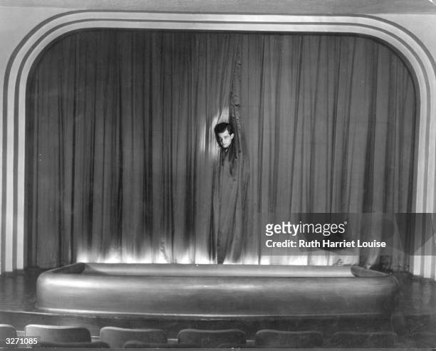 Metro Goldwyn Mayer actor Ramon Novarro on the stage of his private theatre at his Hollywood home.